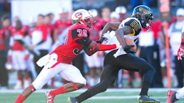 Dec 5, 2015; Bowling Green, KY, USA; Southern Miss Golden Eagles wide receiver Mike Thomas (88) carries the ball away from Western Kentucky Hilltoppers defensive back Prince Charles Iworah (30) during the second half of the Conference USA football championship game at Houchens Industries-L.T. Smith Stadium. Western Kentucky Hilltoppers won 45-28. Mandatory Credit: Joshua Lindsey-USA TODAY Sports