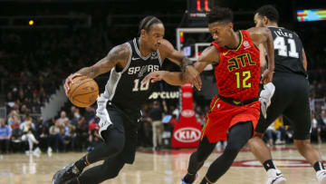 Nov 5, 2019; Atlanta, GA, USA; San Antonio Spurs forward DeMar DeRozan (10) is defended by Atlanta Hawks forward De'Andre Hunter (12) in the third quarter at State Farm Arena. Mandatory Credit: Brett Davis-USA TODAY Sports