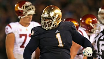 SOUTH BEND, IN - OCTOBER 19: Louis Nix III #1 of the Notre Dame Fighting Irish celebrates near the end of the game against the University of Southern California Trojans at Notre Dame Stadium on October 19, 2013 in South Bend, Indiana. Notre Dame defeated USC 14-10. (Photo by Jonathan Daniel/Getty Images)