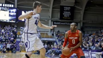 Jan 2, 2016; Evanston, IL, USA; Maryland Terrapins guard Rasheed Sulaimon (0) looks to go around Northwestern Wildcats forward Gavin Skelly (44) during the first half at Welsh-Ryan Arena. Mandatory Credit: Kamil Krzaczynski-USA TODAY Sports