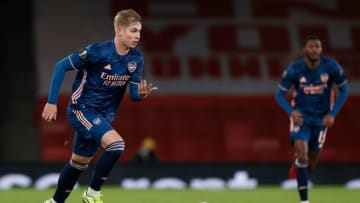 Arsenal's English midfielder Emile Smith Rowe runs with the ball during the UEFA Europa League 1st Round Group B football match between Arsenal and Rapid Vienna at the Emirates Stadium in London on December 3, 2020. (Photo by Adrian DENNIS / AFP) (Photo by ADRIAN DENNIS/AFP via Getty Images)