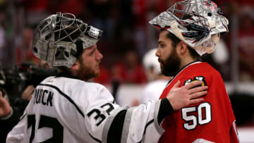 CHICAGO, IL - JUNE 01: (L-R) Jonathan Quick #32 of the Los Angeles Kings talks with Corey Crawford #50 of the Chicago Blackhawks after defeating the Blackhawks 5 to 4 in overtime of Game Seven to win the Western Conference Final in the 2014 Stanley Cup Playoffs at United Center on June 1, 2014 in Chicago, Illinois. (Photo by Jonathan Daniel/Getty Images)