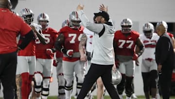 Mar 7, 2023; Columbus, Ohio, USA; Ohio State Buckeyes head coach Ryan Day gathers his players into a huddle at the start of the first day of spring football drills. Mandatory Credit: Adam Cairns-The Columbus DispatchFootball Ohio State Buckeyes Football