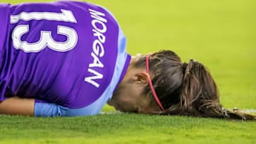 ORLANDO, FL - APRIL 27: Orlando Pride forward Alex Morgan (13) gets fouled during the NWSL soccer match between the Orlando Pride and Utah Royals on April 27, 2019 at Orlando City Stadium in Orlando, FL. (Photo by Andrew Bershaw/Icon Sportswire via Getty Images)