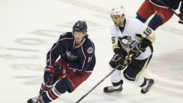 Apr 28, 2014; Columbus, OH, USA; Columbus Blue Jackets center Ryan Johansen (19) carries the puck under pursuit from Pittsburgh Penguins center Brandon Sutter (16) in game six of the first round of the 2014 Stanley Cup Playoffs at Nationwide Arena. Mandatory Credit: Greg Bartram-USA TODAY Sports