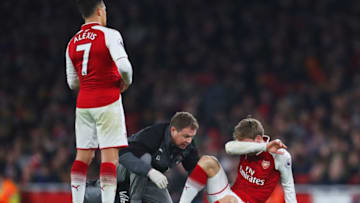 LONDON, ENGLAND - DECEMBER 22: Nacho Monreal of Arsenal is given treatmnt during the Premier League match between Arsenal and Liverpool at Emirates Stadium on December 22, 2017 in London, England. (Photo by Catherine Ivill/Getty Images)