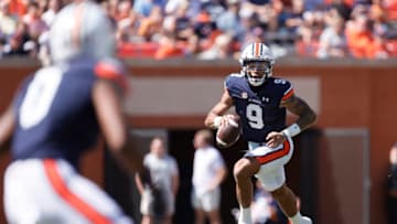 Auburn footballSep 24, 2022; Auburn, Alabama, USA; Auburn Tigers quarterback Robby Ashford (9) rolls out and looks for a receiver during the first quarter against the Missouri Tigers at Jordan-Hare Stadium. Mandatory Credit: John Reed-USA TODAY Sports