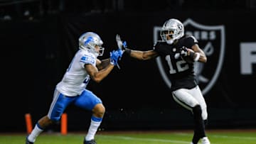 OAKLAND, CA - AUGUST 10: Oakland Raiders wide receiver Martavis Bryant (12) tries to stiff arm a Detroit Lions player during the preseason football game between the Oakland Raiders and the Detroit Lions on August 10,2018 at Oakland-Alameda County Coliseum in Oakland,CA (Photo by Samuel Stringer/Icon Sportswire via Getty Images)