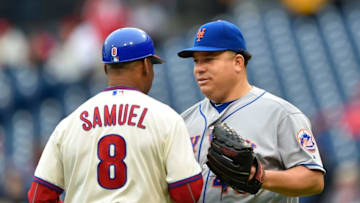 Oct 1, 2016; Philadelphia, PA, USA; New York Mets starting pitcher Bartolo Colon (40) talks to Philadelphia Phillies third base coach Juan Samuel (8) during a baseball game at Citizens Bank Park. Mandatory Credit: Derik Hamilton-USA TODAY Sports