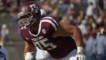 Oct 26, 2013; College Station, TX, USA; Texas A&M Aggies offensive linesman Jake Matthews (75) warms up against the Vanderbilt Commodores before the game at Kyle Field. Mandatory Credit: Thomas Campbell-USA TODAY Sports