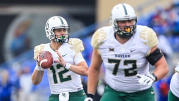 LAWRENCE, KS - NOVEMBER 04: Quarterback Charlie Brewer #12 of the Baylor Bears looks to pass against the Kansas Jayhawks defense during the first half at Memorial Stadium on November 4, 2017 in Lawrence, Kansas. (Photo by Brian Davidson/Getty Images)