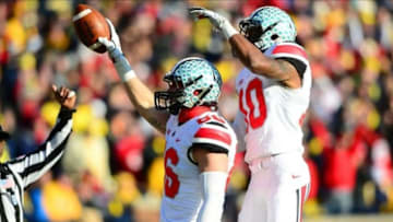 Nov 30, 2013; Ann Arbor, MI, USA; Ohio State Buckeyes tight end Jeff Heuerman (86) catches a pass in the end zone for a touchdown during the third quarter against the Michigan Wolverines at Michigan Stadium. Mandatory Credit: Andrew Weber-USA TODAY Sports