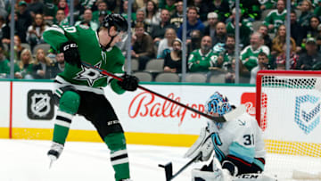 Jan 12, 2022; Dallas, Texas, USA; Seattle Kraken goaltender Philipp Grubauer (31) makes a save against Dallas Stars center Jacob Peterson (40) in the second period at American Airlines Center. Mandatory Credit: Tim Heitman-USA TODAY Sports