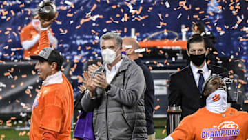 Dec 19, 2020; Charlotte, NC, USA; Clemson head coach Dabo Swinney holds up the ACC Championship trophy after beating Notre Dame 34-10 in the ACC Championship game at Bank of America Stadium. Mandatory Credit: Ken Ruinard-USA TODAY Sports