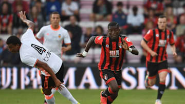BOURNEMOUTH, ENGLAND - AUGUST 03: Max Gradel of Bournemouth gets past Adellan Santos of Valencia during a pre-season friendly between Bournemouth and Valencia at the Vitality Stadium on August 3, 2016 in Bournemouth, England. (Photo by Mike Hewitt/Getty Images)