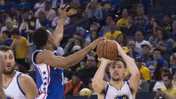 March 27, 2016; Oakland, CA, USA; Golden State Warriors guard Klay Thompson (11) shoots the basketball against Philadelphia 76ers guard Ish Smith (1) during the third quarter at Oracle Arena. The Warriors defeated the 76ers 117-105. Mandatory Credit: Kyle Terada-USA TODAY Sports