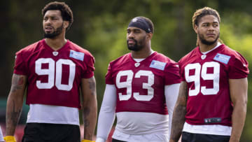 ASHBURN, VA - JUNE 10: Chase Young #99 of the Washington Football Team stands with Jonathan Allen #93 and Montez Sweat #90 during mandatory minicamp at Inova Sports Performance Center on June 10, 2021 in Ashburn, Virginia. (Photo by Scott Taetsch/Getty Images)