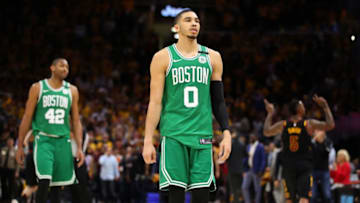 CLEVELAND, OH - MAY 21: Jayson Tatum #0 and Al Horford #42 of the Boston Celtics walk off the court as JR Smith #5 of the Cleveland Cavaliers reacts after the Cavaliers defeated the Celtics during Game Four of the 2018 NBA Eastern Conference Finals at Quicken Loans Arena on May 21, 2018 in Cleveland, Ohio. NOTE TO USER: User expressly acknowledges and agrees that, by downloading and or using this photograph, User is consenting to the terms and conditions of the Getty Images License Agreement. (Photo by Gregory Shamus/Getty Images)