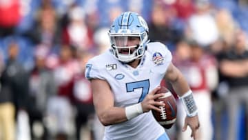 ANNAPOLIS, MD - DECEMBER 27: Sam Howell #7 of the North Carolina Tar Heels rushes the ball against the Temple Owls in the Military Bowl Presented by Northrop Grumman at Navy-Marine Corps Memorial Stadium on December 27, 2019 in Annapolis, Maryland. (Photo by G Fiume/Getty Images)