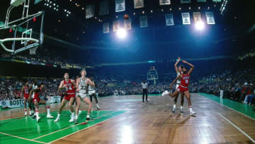 BOSTON - 1982: Chris Ford #42 of the Boston Celtics puts up a shot against Lionel Hollins #9 of the Philadelphia 76ers during a game played in 1982 at the Boston Garden in Boston, Massachusetts. NOTE TO USER: User expressly acknowledges and agrees that, by downloading and or using this photograph, User is consenting to the terms and conditions of the Getty Images License Agreement. Mandatory Copyright Notice: Copyright 1982 NBAE (Photo by Dick Raphael/NBAE via Getty Images)