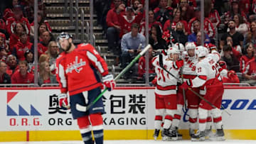 WASHINGTON, DC - OCTOBER 05: Jaccob Slavin #74 of the Carolina Hurricanes celebrates with his teammates after scoring a goal in the third period against the Washington Capitals at Capital One Arena on October 5, 2019 in Washington, DC. (Photo by Patrick McDermott/NHLI via Getty Images)