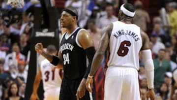 Apr 8, 2014; Miami, FL, USA; Brooklyn Nets forward Paul Pierce (34) pumps his fist next to Miami Heat forward LeBron James (6) during the second half at American Airlines Arena. The Nets won 88-87. Mandatory Credit: Steve Mitchell-USA TODAY Sports