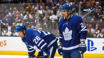 TORONTO, ON - DECEMBER 22: Connor Brown #28 and Nikita Zaitsev #22 of the Toronto Maple Leafs wait on a face off against the New York Rangers during the second period at the Scotiabank Arena on December 22, 2018 in Toronto, Ontario, Canada. (Photo by Mark Blinch/NHLI via Getty Images)
