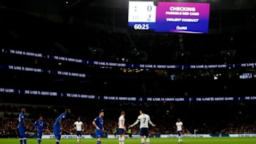 Tottenham Hotspur's South Korean striker Son Heung-Min (C) gestures as a VAR (Video Assistant Referee) check is made ahead of him being sent off during the English Premier League football match between Tottenham Hotspur and Chelsea at Tottenham Hotspur Stadium in London, on December 22, 2019. (Photo by Adrian DENNIS / AFP) / RESTRICTED TO EDITORIAL USE. No use with unauthorized audio, video, data, fixture lists, club/league logos or 'live' services. Online in-match use limited to 120 images. An additional 40 images may be used in extra time. No video emulation. Social media in-match use limited to 120 images. An additional 40 images may be used in extra time. No use in betting publications, games or single club/league/player publications. / (Photo by ADRIAN DENNIS/AFP via Getty Images)