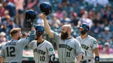 CLEVELAND, OH - MAY 27: Max Stassi #12, Yuli Gurriel #10, Evan Gattis #11 and Carlos Correa #1 of the Houston Astros celebrate after Gattis' three-run home run during the eighth inning against the Cleveland Indians at Progressive Field on May 27, 2018 in Cleveland, Ohio. (Photo by Jason Miller/Getty Images)