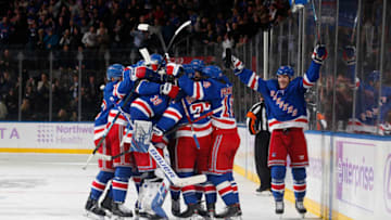 The New York Rangers celebrate after defeating the Minnesota Wild