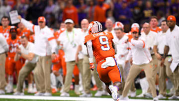 NEW ORLEANS, LA - JANUARY 13: Travis Etienne #9 of the Clemson Tigers rushes against the LSU Tigers during the College Football Playoff National Championship held at the Mercedes-Benz Superdome on January 13, 2020 in New Orleans, Louisiana. (Photo by Jamie Schwaberow/Getty Images)