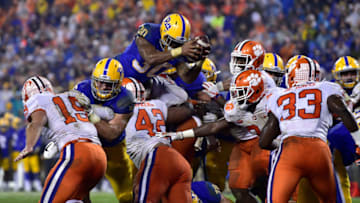 CHARLOTTE, NC - DECEMBER 01: Qadree Ollison #30 of the Pittsburgh Panthers dives for a touchdown against the Clemson Tigers during the second quarter of their game at Bank of America Stadium on December 1, 2018 in Charlotte, North Carolina. (Photo by Grant Halverson/Getty Images)