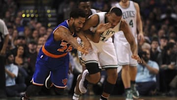 Nov 11, 2016; Boston, MA, USA; New York Knicks guard Derrick Rose (25) and Boston Celtics guard Avery Bradley (0) battle for a loose ball during the second half at TD Garden. Mandatory Credit: Bob DeChiara-USA TODAY Sports