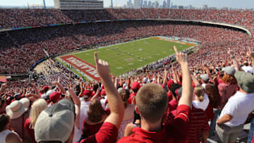 DALLAS, TX - OCTOBER 14: Fans cheer during the kickoff for the game between the Oklahoma Sooners and Texas Longhorns at Cotton Bowl on October 14, 2017 in Dallas, Texas. The Dallas skyline appears in the background. (Photo by Richard W. Rodriguez/Getty Images)