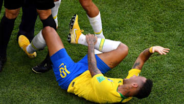 SAMARA, RUSSIA - JULY 02: Neymar Jr of Brazil goes down injured during the 2018 FIFA World Cup Russia Round of 16 match between Brazil and Mexico at Samara Arena on July 2, 2018 in Samara, Russia. (Photo by Hector Vivas/Getty Images)
