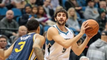 Apr 16, 2014; Minneapolis, MN, USA; Minnesota Timberwolves guard Ricky Rubio (9) passes in the first quarter against the Utah Jazz guard Trey Burke (3) at Target Center. Mandatory Credit: Brad Rempel-USA TODAY Sports