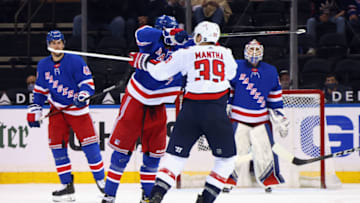 May 5, 2021; New York, New York, USA; Pavel Buchnevich #89 of the New York Rangers takes a high-sticking penalty on Anthony Mantha #39 of the Washington Capitals during the second period at Madison Square Garden. Mandatory Credit: Bruce Bennett/POOL PHOTOS-USA TODAY Sports