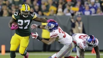 Oct 9, 2016; Green Bay, WI, USA; Green Bay Packers running back Eddie Lacy runs for a first down against New York Giants defender Andrew Adams in the second quarter at Lambeau Field. Mandatory Credit: Dan Powers/The Post-Crescent via USA TODAY Sports