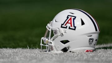 BERKELEY, CALIFORNIA - SEPTEMBER 24: A detailed view of the helmet belonging to quarterback Jayden de Laura #7 of the Arizona Wildcats sitting on the field during pregame warmups prior to play the California Golden Bears at FTX Field at California Memorial Stadium on September 24, 2022 in Berkeley, California. (Photo by Thearon W. Henderson/Getty Images)