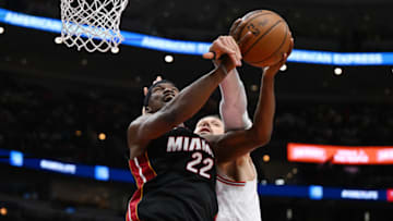 Jimmy Butler #22 of the Miami Heat is fouled by Nikola Vucevic #9 of the Chicago Bulls(Photo by Quinn Harris/Getty Images)