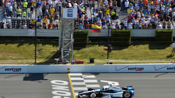 LONG POND, PA - JULY 6 : Juan Pablo Montoya of Colombia, driver of the #2 PPG Team Penske Chevrolet, crosses the finish line to win the Pocono INDYCAR 500 at Pocono Raceway on July 6, 2014 in Long Pond, Pennsylvania. (Photo by Drew Hallowell/Getty Images)