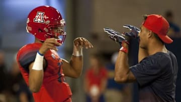 Sep 10, 2016; Tucson, AZ, USA; Arizona Wildcats quarterback Brandon Dawkins (13) and quarterback Anu Solomon (12) (right) talk during warms up before playing the Grambling State Tigers at Arizona Stadium. Mandatory Credit: Casey Sapio-USA TODAY Sports