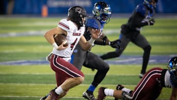 Dec 5, 2020; Lexington, Kentucky, USA; South Carolina Gamecocks quarterback Luke Doty (4) runs the ball during the fourth quarter against the Kentucky Wildcats at Kroger Field. Mandatory Credit: Arden Barnes-USA TODAY Sports