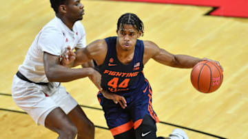 Dec 20, 2020; Piscataway, New Jersey, USA; Illinois Fighting Illini guard Adam Miller (44) dribbles the ball during a game against the Rutgers Scarlet Knights in the first half at Rutgers Athletic Center (RAC). Mandatory Credit: Catalina Fragoso-USA TODAY Sports