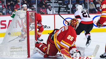 CALGARY, AB - JANUARY 13: Nick Paul #21 of the Ottawa Senators scores against Jacob Markstrom #25 of the Calgary Flames during an NHL game at Scotiabank Saddledome on January 13, 2022 in Calgary, Alberta, Canada. (Photo by Derek Leung/Getty Images)