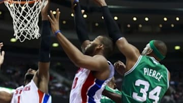 January 20, 2013; Auburn Hills, MI, USA; Detroit Pistons center Andre Drummond (1) center Greg Monroe (10) and Boston Celtics small forward Paul Pierce (34) go for a rebound in the fourth quarter at The Palace. Detroit won 103-88. Mandatory Credit: Rick Osentoski-USA TODAY Sports