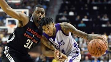 LAS VEGAS, NV - JULY 07: Brandon Ingram #14 of the Los Angeles Lakers drives against Hollis Thompson #31 of the Los Angeles Clippers during the 2017 Summer League at the Thomas & Mack Center on July 7, 2017 in Las Vegas, Nevada. The Clippers won 96-93 in overtime. NOTE TO USER: User expressly acknowledges and agrees that, by downloading and or using this photograph, User is consenting to the terms and conditions of the Getty Images License Agreement. (Photo by Ethan Miller/Getty Images)