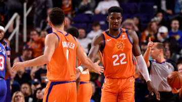 PHOENIX, AZ - JANUARY 3: Devin Booker #1, and Deandre Ayton #22 of the Phoenix Suns hi-five each other during the game against the New York Knicks on January 3, 2020 at Talking Stick Resort Arena in Phoenix, Arizona. NOTE TO USER: User expressly acknowledges and agrees that, by downloading and or using this photograph, user is consenting to the terms and conditions of the Getty Images License Agreement. Mandatory Copyright Notice: Copyright 2020 NBAE (Photo by Barry Gossage/NBAE via Getty Images)