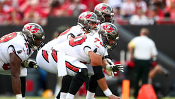 TAMPA, FL - OCTOBER 9: Robert Hainsey #70 of the Tampa Bay Buccaneers and the offensive line lines up before a play during an NFL football game against the Atlanta Falcons at Raymond James Stadium on October 9, 2022 in Tampa, Florida. (Photo by Kevin Sabitus/Getty Images)