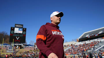 CHARLOTTESVILLE, VA - NOVEMBER 29: Head coach Justin Fuente of the Virginia Tech Hokies walks off the field before the start of a game against the Virginia Cavaliers at Scott Stadium on November 29, 2019 in Charlottesville, Virginia. (Photo by Ryan M. Kelly/Getty Images)